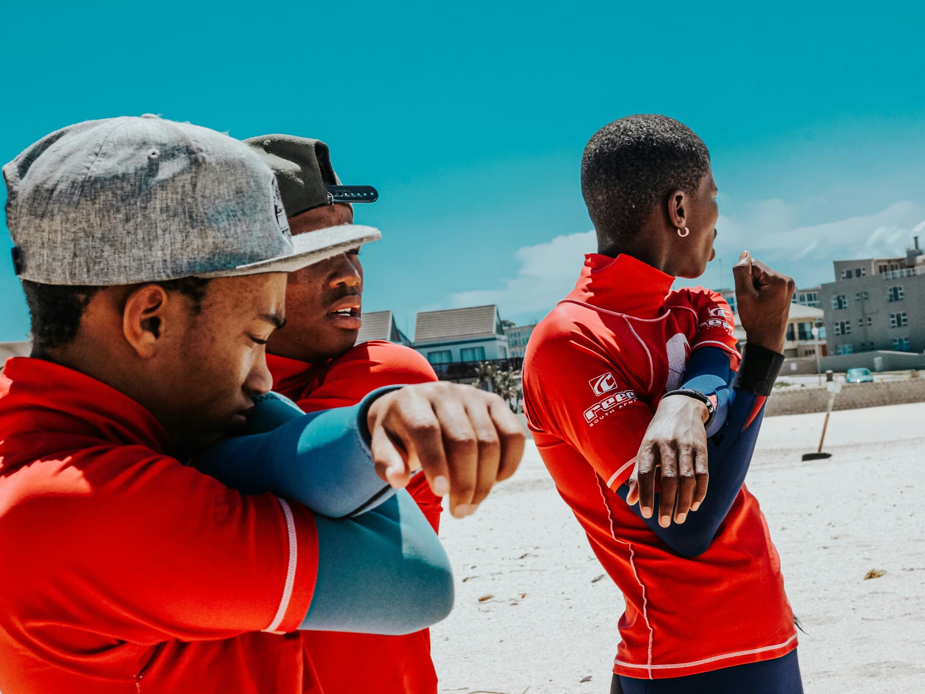Coach and athletes reviewing tactical movement and environmental demands during regional tournament preparation